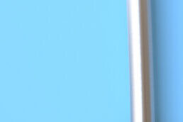 Close-up of a blue surface with a white edge and a vertical white line.